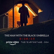     / The Man with the Black Umbrella